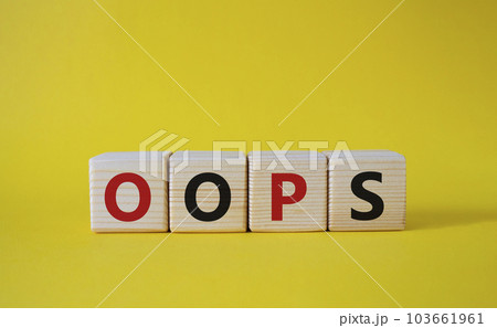 Oops symbol. Concept word Oops on wooden cubes. Beautiful yellow background. Business and Oops concept. Copy space. 103661961