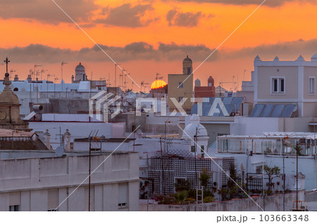 Picturesque sunset over the rooftops of Spanish Cadiz. 103663348