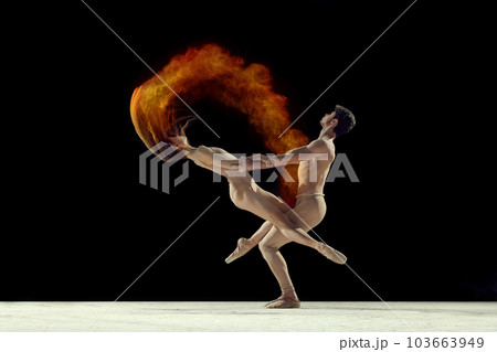 Support. Young graceful ballet dancers, man and woman ion beige bodysuits dancing with powder explosion against black studio background Support. Young graceful ballet dancers, man and woman ion beige bodysuits dancing with powder explosion against black studio background 103663949