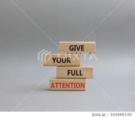 Give your full Attention symbol. Concept word Give your full Attention on wooden blocks. Beautiful grey background. Business and Give your full Attention concept. Copy space Give your full Attention symbol. Concept word Give your full Attention on wooden blocks. Beautiful grey background. Business and Give your full Attention concept. Copy space 103666148
