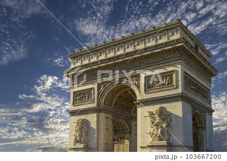 Arc de Triomphe (against the background of sky with clouds), Paris, France. The walls of the arch are engraved with the names of 128 battles and names of 660 French military leaders (in French) 103667200