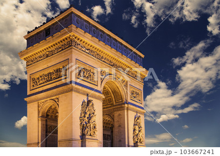 Arc de Triomphe (against the background of sky with clouds), Paris, France. The walls of the arch are engraved with the names of 128 battles and names of 660 French military leaders (in French) Arc de Triomphe (against the background of sky with clouds), Paris, France. The walls of the arch are engraved with the names of 128 battles and names of 660 French military leaders (in French) 103667241