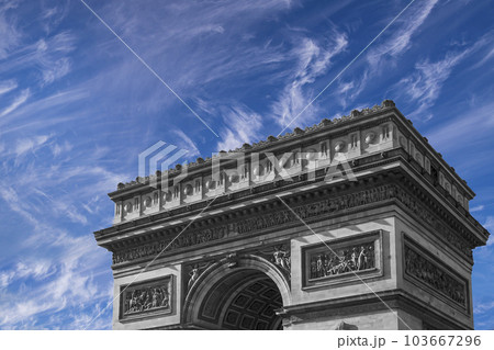 Arc de Triomphe (against the background of sky with clouds), Paris, France. The walls of the arch are engraved with the names of 128 battles and names of 660 French military leaders (in French) Arc de Triomphe (against the background of sky with clouds), Paris, France. The walls of the arch are engraved with the names of 128 battles and names of 660 French military leaders (in French) 103667296