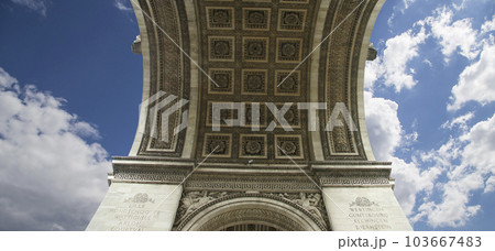 Arc de Triomphe (against the background of sky with clouds), Paris, France. The walls of the arch are engraved with the names of 128 battles and names of 660 French military leaders (in French) 103667483