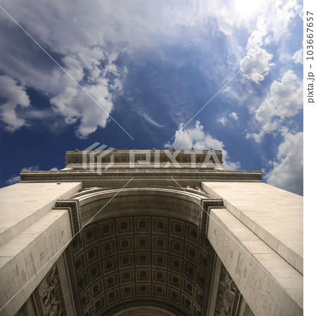Arc de Triomphe (against the background of sky with clouds), Paris, France. The walls of the arch are engraved with the names of 128 battles and names of 660 French military leaders (in French) Arc de Triomphe (against the background of sky with clouds), Paris, France. The walls of the arch are engraved with the names of 128 battles and names of 660 French military leaders (in French) 103667657