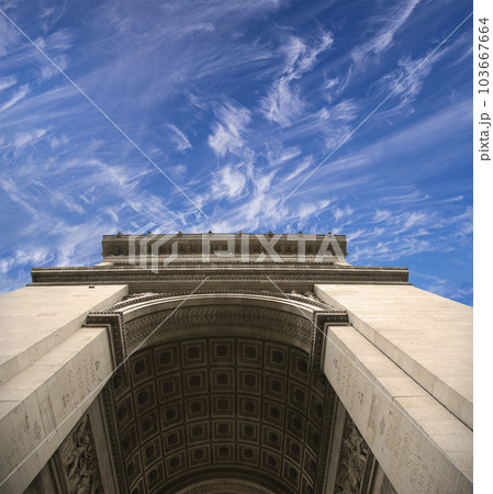 Arc de Triomphe (against the background of sky with clouds), Paris, France. The walls of the arch are engraved with the names of 128 battles and names of 660 French military leaders (in French) 103667664