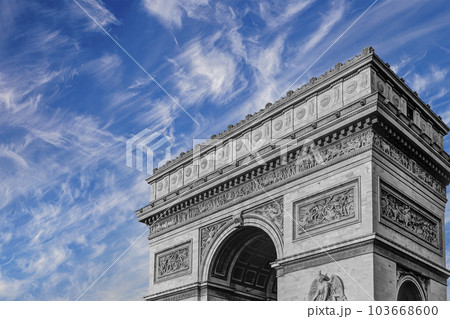 Arc de Triomphe (against the background of sky with clouds), Paris, France. The walls of the arch are engraved with the names of 128 battles and names of 660 French military leaders (in French) 103668600