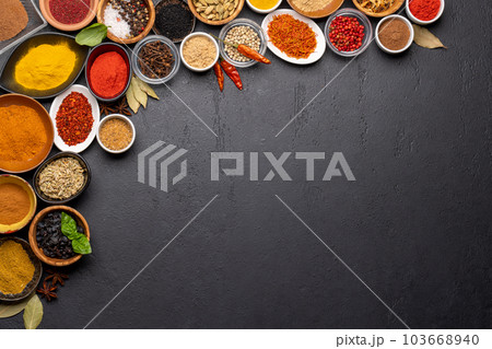 Various spices in bowls on stone table Various spices in bowls on stone table 103668940