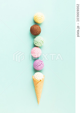 Flying ice cream balls on pastel light blue background 103669002