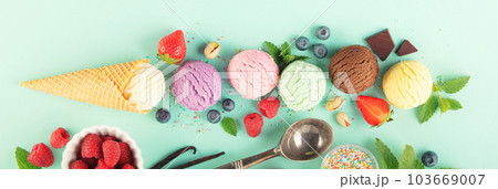 Flying ice cream balls and ingredients on pastel light blue background 103669007