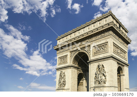 Arc de Triomphe (against the background of sky with clouds), Paris, France. The walls of the arch are engraved with the names of 128 battles and names of 660 French military leaders (in French) Arc de Triomphe (against the background of sky with clouds), Paris, France. The walls of the arch are engraved with the names of 128 battles and names of 660 French military leaders (in French) 103669170