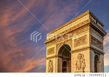 Arc de Triomphe (against the background of sky with clouds), Paris, France. The walls of the arch are engraved with the names of 128 battles and names of 660 French military leaders (in French) Arc de Triomphe (against the background of sky with clouds), Paris, France. The walls of the arch are engraved with the names of 128 battles and names of 660 French military leaders (in French) 103669211