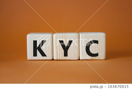 KYC - Know Your Customer. Wooden cubes with word KYC. Beautiful orange background. Business and Know Your Customer concept. Copy space. 103670015