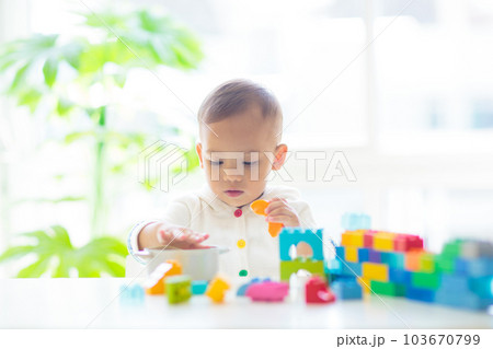 Baby boy playing with toy 103670799