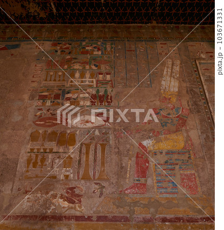 Temple of Hatshepsut, Luxor Egypt showing court-chapel OF ANUBIS with scene of Thutmose III offerings wine to the god Sokar one of gods of the dead Temple of Hatshepsut, Luxor Egypt showing court-chapel OF ANUBIS with scene of Thutmose III offerings wine to the god Sokar one of gods of the dead 103671331