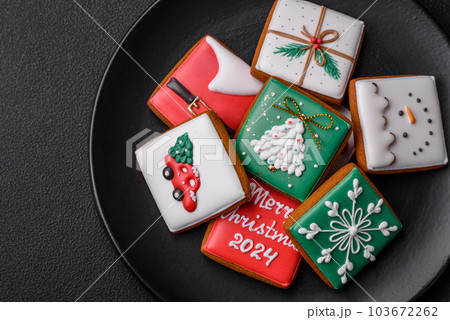 Beautiful colored Christmas gingerbread cookies for the design and decoration Beautiful colored Christmas gingerbread cookies for the design and decoration 103672262