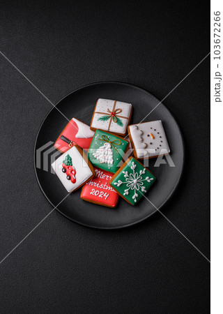 Beautiful colored Christmas gingerbread cookies for the design and decoration Beautiful colored Christmas gingerbread cookies for the design and decoration 103672266