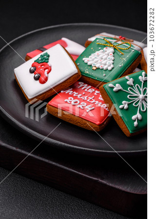 Beautiful colored Christmas gingerbread cookies for the design and decoration Beautiful colored Christmas gingerbread cookies for the design and decoration 103672282
