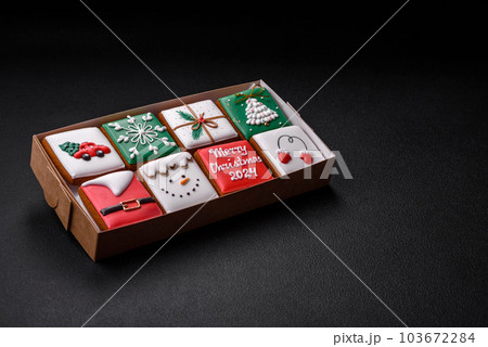 Beautiful colored Christmas gingerbread cookies for the design and decoration Beautiful colored Christmas gingerbread cookies for the design and decoration 103672284