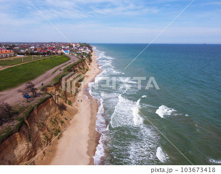 Empty sunny summer sand beach with clear sea water. Empty sunny summer sand beach with clear sea water. 103673418