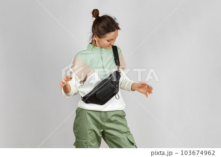 Woman with Black Leather Crossbody Fanny Pack Bag Woman with Black Leather Crossbody Fanny Pack Bag 103674962
