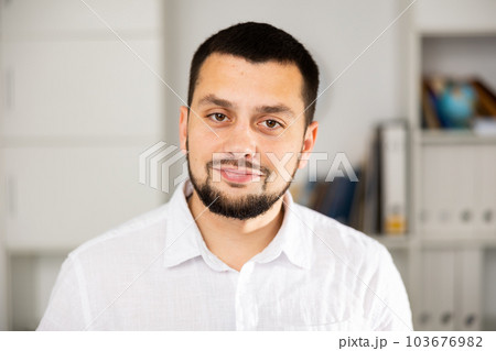 Portrait of positive man office worker 103676982