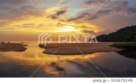 .aerial view stunning reflection of bright golden sky in a canal at Karon beach Phuket. 103678248
