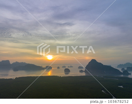 aerial view Amazing light of nature cloudscape sky above Samed Nang Chee Phang Nga archipelago. .Imagine a fantasy bright red sky at sunrise from a bird's eye view..tropical landscape background. aerial view Amazing light of nature cloudscape sky above Samed Nang Chee Phang Nga archipelago. .Imagine a fantasy bright red sky at sunrise from a bird's eye view..tropical landscape background. 103678252
