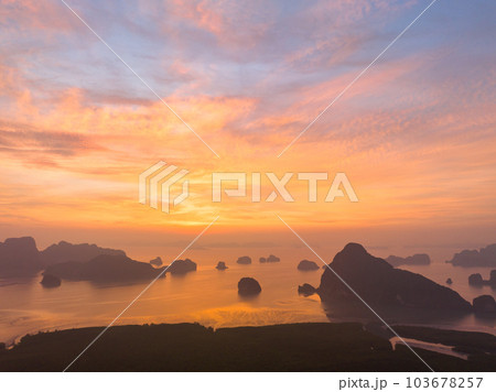 aerial view Amazing light of nature cloudscape sky above Samed Nang Chee Phang Nga archipelago. .Imagine a fantasy bright red sky at sunrise from a bird's eye view..tropical landscape background. 103678257