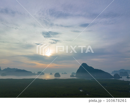 aerial view Amazing light of nature cloudscape sky above Samed Nang Chee Phang Nga archipelago. .Imagine a fantasy bright red sky at sunrise from a bird's eye view..tropical landscape background. 103678261