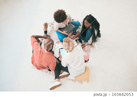 Teamwork, unity and support with diverse group students from above. Brainstorming and planning a creative strategy while working on a project. Young designers sharing ideas, researching and talking 103682053
