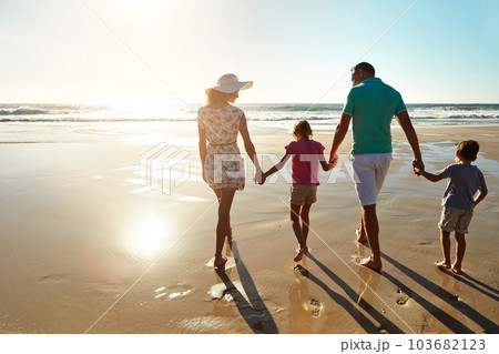 Loving the beach days. a family enjoying some quality time together at the beach. 103682123