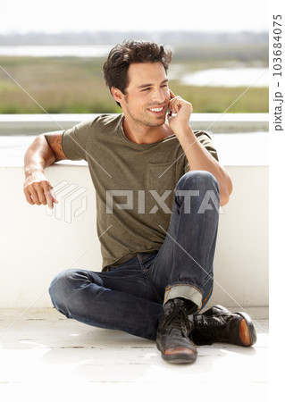 Smile, phone call and man with connection, outdoor and relax with communication. Male person, network and guy with a smartphone, talking and mobile app with casual outfit, trendy clothes and talking 103684075