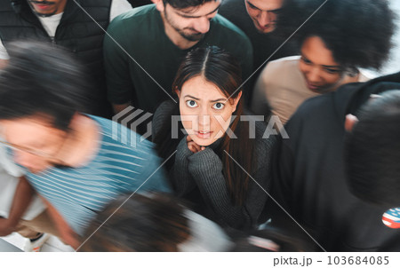 These clouds theyre seeing, theyre explosions in the sky. Shot of a young woman experiencing mental illness while being surrounded by people inside. These clouds theyre seeing, theyre explosions in the sky. Shot of a young woman experiencing mental illness while being surrounded by people inside. 103684085