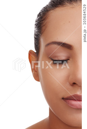 Complexion perfection. Closeup studio shot of a young woman with beautiful skin posing against a white background. Complexion perfection. Closeup studio shot of a young woman with beautiful skin posing against a white background. 103684529