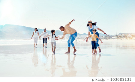 Family, beach and parents play with children for bonding, quality time and adventure together. Travel, freedom and happy mom, dad and kids enjoy summer holiday, vacation and relax on weekend by sea 103685133