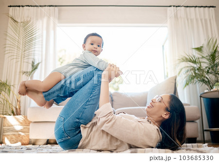 Home, love and mother play with baby for family bonding, quality time and child development together. New born, motherhood and happy mom carry infant for care, support and relationship in living room 103685330