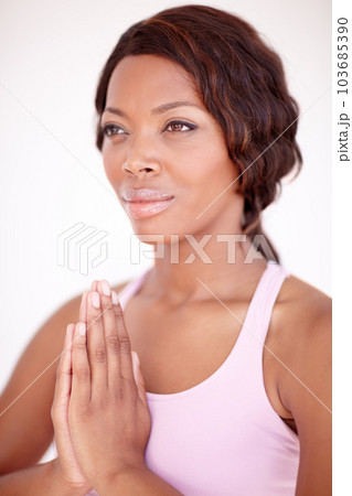 Woman, praying hands and yoga for peace in studio with gratitude, focus and breathing by white background. Girl, prayer sign and zen vision for wellness, mindfulness and spiritual health by backdrop Woman, praying hands and yoga for peace in studio with gratitude, focus and breathing by white background. Girl, prayer sign and zen vision for wellness, mindfulness and spiritual health by backdrop 103685390