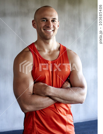 Happy man, fitness and portrait smile with arms crossed in confidence for workout, exercise or training at gym. Strong muscular male and confident personal trainer, leader or coach in bodybuilding Happy man, fitness and portrait smile with arms crossed in confidence for workout, exercise or training at gym. Strong muscular male and confident personal trainer, leader or coach in bodybuilding 103685486