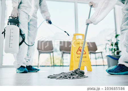 Covid disinfection, cleaning hospital floor with mop and healthcare compliance for safety and hygiene. Disinfecting liquid, cleaner people in PPE for protection from corona virus with medical policy 103685586