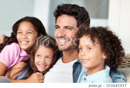 Love, happy family father and children hug, relax and enjoy bonding quality time together with dad. Fathers day, looking and youth kids, parents or group of young siblings hugging papa on home sofa 103685937