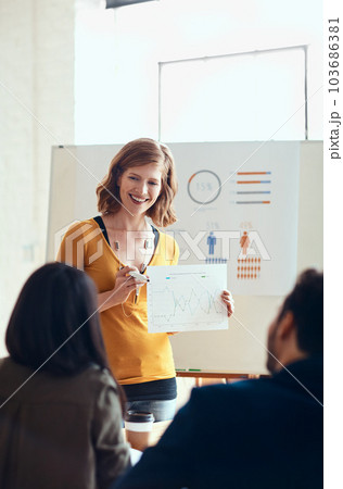 I trust you all got a copy of this. an attractive young businesswoman giving a presentation in the boardroom. I trust you all got a copy of this. an attractive young businesswoman giving a presentation in the boardroom. 103686381