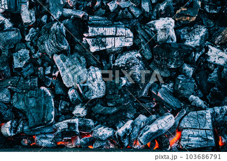 Background of burning hot coals. Burning coals in the brazier, barbecue grill 103686791