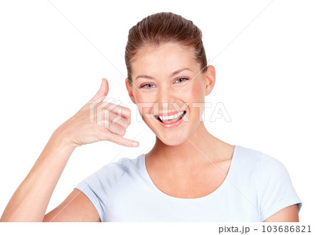 Portrait, woman and call me with smile, white background and hands for communication in isolated studio. Happy face, female model and telephone sign for talking, contact or connection of conversation Portrait, woman and call me with smile, white background and hands for communication in isolated studio. Happy face, female model and telephone sign for talking, contact or connection of conversation 103686821