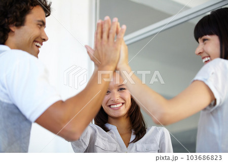 Happy business people, high five and celebration for winning, teamwork or success at office. Group of excited employees touching hands in collaboration for victory, win or team building at workplace Happy business people, high five and celebration for winning, teamwork or success at office. Group of excited employees touching hands in collaboration for victory, win or team building at workplace 103686823