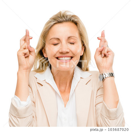 Cross finger, face and professional woman in studio background with a smile for good luck with promotion. Hope, excited and business person for wish hands and success with finance in mock up. Cross finger, face and professional woman in studio background with a smile for good luck with promotion. Hope, excited and business person for wish hands and success with finance in mock up. 103687020