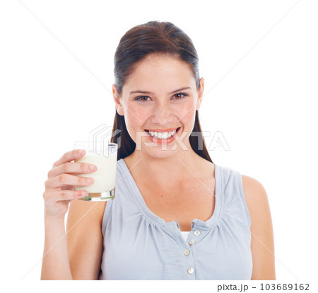 Face portrait, happy woman and milk glass for vitamin D healthcare benefits, bone health or nutritionist hydration drink. Calcium dairy product, wellness and studio model isolated on white background 103689162