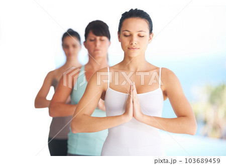 Prayer hands, meditation and woman with yoga exercise outdoor with zen and pilates instructor. Spiritual, namaste and wellness of training, workout and peace from fitness friends group feeling calm Prayer hands, meditation and woman with yoga exercise outdoor with zen and pilates instructor. Spiritual, namaste and wellness of training, workout and peace from fitness friends group feeling calm 103689459