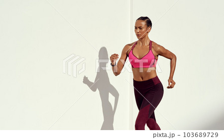Woman, fitness and running on mockup for exercise, workout or healthy cardio training outdoors. Fit, active and sporty female person or runner exercising for health and wellness on mock up space 103689729