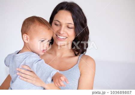 Just me and my baby. a beautiful young woman and her baby at home. 103689807